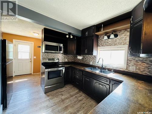 82 3Rd Avenue E, Central Butte, SK - Indoor Photo Showing Kitchen With Double Sink