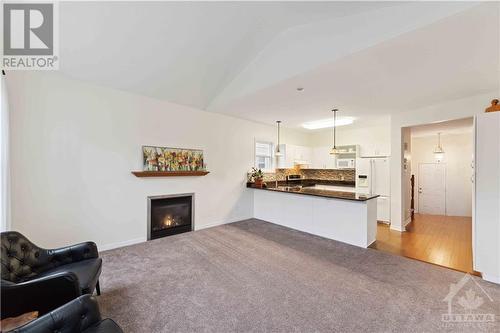 122 Streamside Crescent, Ottawa, ON - Indoor Photo Showing Living Room With Fireplace