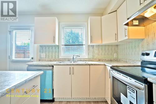 Kitchen Main Floor - 67 - 7768 Ascot Circle, Niagara Falls, ON - Indoor Photo Showing Kitchen With Double Sink