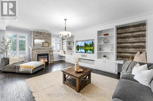 77 Gimblett Street W, Clarington (Bowmanville), ON - Indoor Photo Showing Living Room With Fireplace