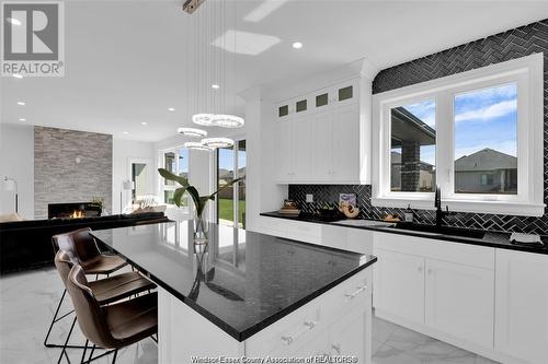 2596 Mayfair, Lasalle, ON - Indoor Photo Showing Kitchen With Fireplace