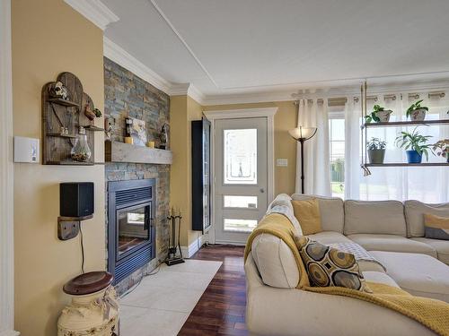 Living room - 969 Boul. De L'Ange-Gardien N., L'Assomption, QC - Indoor Photo Showing Living Room With Fireplace