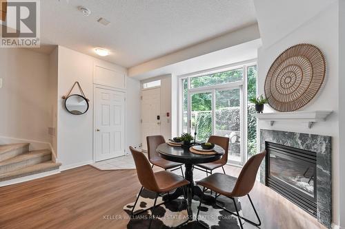 601 - 38 Stadium Road S, Toronto, ON - Indoor Photo Showing Dining Room With Fireplace