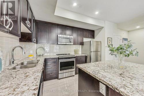 254 - 27 Applewood Lane, Toronto, ON - Indoor Photo Showing Kitchen With Stainless Steel Kitchen With Double Sink With Upgraded Kitchen