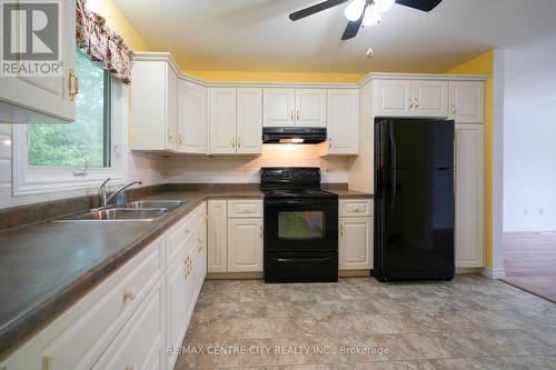 11 Pittao Place, Strathroy-Caradoc (Ne), ON - Indoor Photo Showing Kitchen With Double Sink