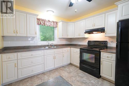 11 Pittao Place, Strathroy-Caradoc (Ne), ON - Indoor Photo Showing Kitchen With Double Sink