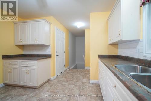 11 Pittao Place, Strathroy-Caradoc (Ne), ON - Indoor Photo Showing Kitchen With Double Sink