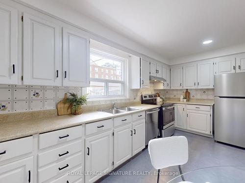 2 Conway Ave, Toronto, ON - Indoor Photo Showing Kitchen With Double Sink