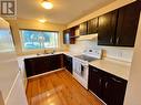 100 501 9Th Ave, Campbell River, BC  - Indoor Photo Showing Kitchen With Double Sink 