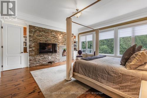 25 Riverstone Court, East Gwillimbury, ON - Indoor Photo Showing Bedroom With Fireplace