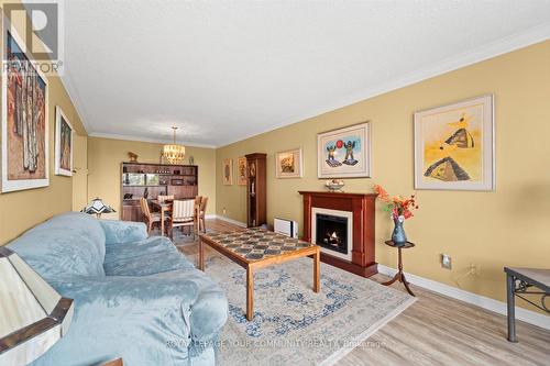 307 - 40 Baif Boulevard, Richmond Hill, ON - Indoor Photo Showing Living Room With Fireplace