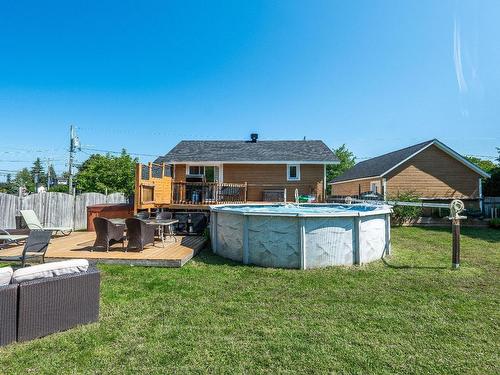 Cour - 152 29E Avenue, Sainte-Marthe-Sur-Le-Lac, QC - Outdoor With Above Ground Pool With Backyard