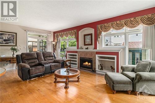 163 Yoho Drive, Kanata, ON - Indoor Photo Showing Living Room With Fireplace