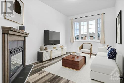 Virtually Staged - 125 Desmond Trudeau Drive, Arnprior, ON - Indoor Photo Showing Living Room With Fireplace