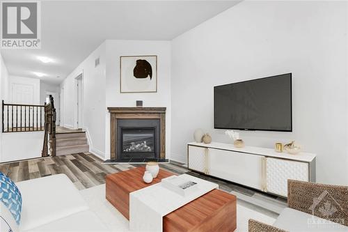 Virtually Staged - 125 Desmond Trudeau Drive, Arnprior, ON - Indoor Photo Showing Living Room With Fireplace