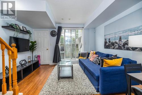 90 - 65 Turntable Crescent, Toronto (Dovercourt-Wallace Emerson-Junction), ON - Indoor Photo Showing Living Room