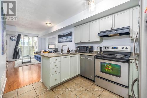 90 - 65 Turntable Crescent, Toronto (Dovercourt-Wallace Emerson-Junction), ON - Indoor Photo Showing Kitchen With Double Sink