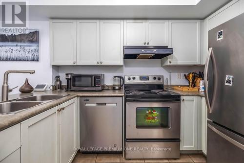 90 - 65 Turntable Crescent, Toronto (Dovercourt-Wallace Emerson-Junction), ON - Indoor Photo Showing Kitchen With Double Sink