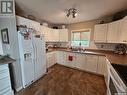 359 4Th Avenue Se, Swift Current, SK  - Indoor Photo Showing Kitchen With Double Sink 