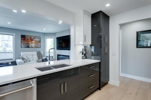 309-1385 Bertram Street, Kelowna, BC - Indoor Photo Showing Kitchen With Double Sink