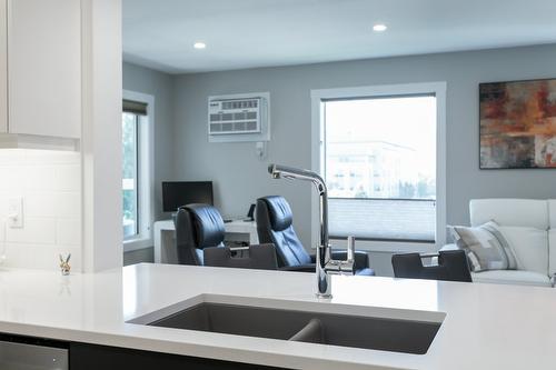 309-1385 Bertram Street, Kelowna, BC - Indoor Photo Showing Kitchen With Double Sink