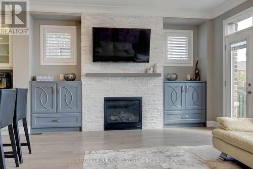 3139 Riverpath Common, Oakville, ON - Indoor Photo Showing Living Room With Fireplace