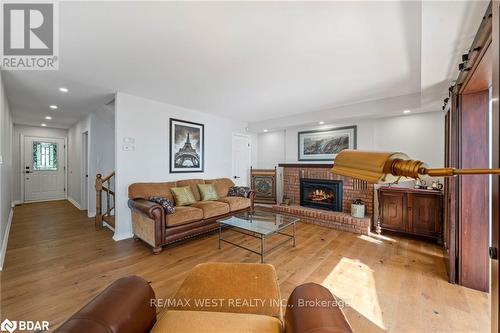 38 Willow Drive, Tiny, ON - Indoor Photo Showing Living Room With Fireplace