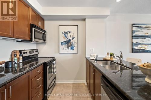 217 - 61 Clarington Boulevard, Clarington (Bowmanville), ON - Indoor Photo Showing Kitchen With Double Sink