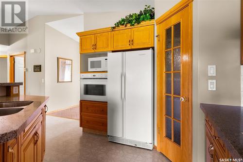 76 St Andrews Bay, Emerald Park, SK - Indoor Photo Showing Kitchen With Double Sink