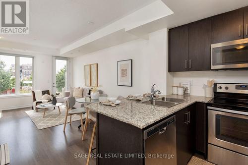 20 - 115 Long Branch Avenue, Toronto (Long Branch), ON - Indoor Photo Showing Kitchen With Double Sink