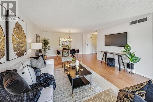 303 - 95 Wellington Street, Clarington (Bowmanville), ON - Indoor Photo Showing Living Room With Fireplace