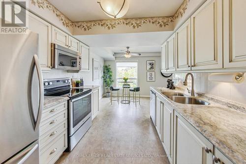 303 - 95 Wellington Street, Clarington (Bowmanville), ON - Indoor Photo Showing Kitchen With Double Sink With Upgraded Kitchen