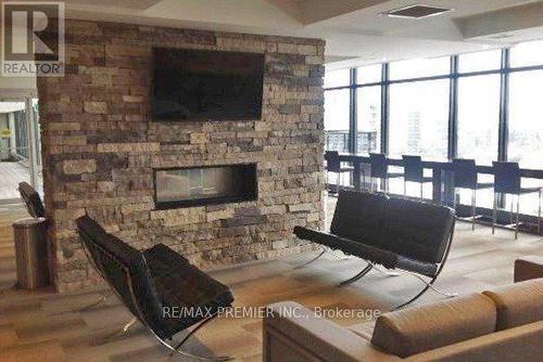 2406 - 330 Phillip Street, Waterloo, ON - Indoor Photo Showing Living Room With Fireplace