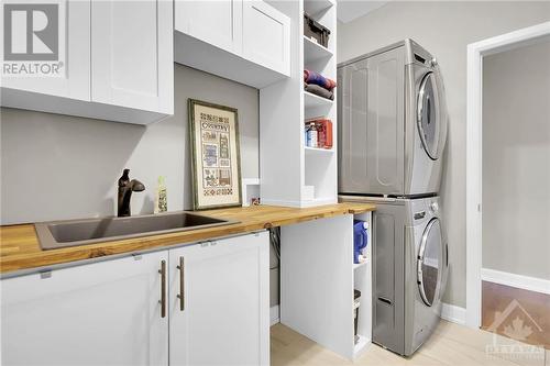 Mudroom with laundry, closets & inside access from garage. - 215 Capri Avenue, Embrun, ON - Indoor Photo Showing Laundry Room