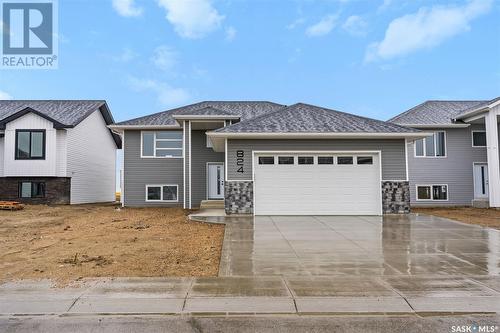 824 Weir Crescent, Warman, SK - Outdoor With Facade