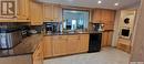 425 6Th Avenue E, Unity, SK  - Indoor Photo Showing Kitchen With Double Sink 