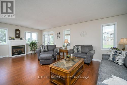 9 Quaker Court, Prince Edward County (Wellington), ON - Indoor Photo Showing Living Room With Fireplace