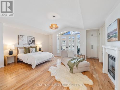 21 Drummondville Lane, Toronto (East End-Danforth), ON - Indoor Photo Showing Bedroom With Fireplace