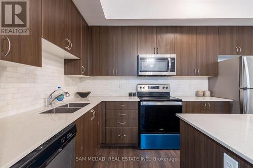 F402 - 26 Coles Avenue, Vaughan (Vaughan Grove), ON - Indoor Photo Showing Kitchen With Stainless Steel Kitchen With Double Sink