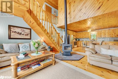 1018A Leisure Lane, Cloyne, ON - Indoor Photo Showing Living Room With Fireplace