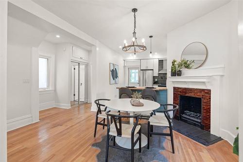 469 Gertrude Avenue, Winnipeg, MB - Indoor Photo Showing Dining Room With Fireplace