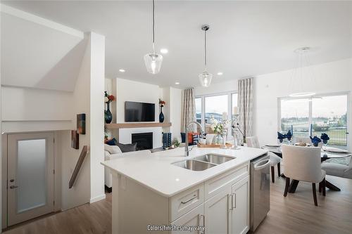 10 Barnes Place, West St Paul, MB - Indoor Photo Showing Kitchen With Double Sink