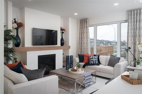 10 Barnes Place, West St Paul, MB - Indoor Photo Showing Living Room With Fireplace