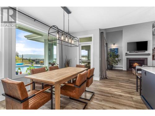 115 Echo Ridge Drive, Kelowna, BC - Indoor Photo Showing Dining Room With Fireplace