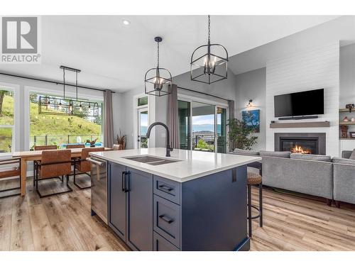 115 Echo Ridge Drive, Kelowna, BC - Indoor Photo Showing Kitchen With Fireplace With Double Sink