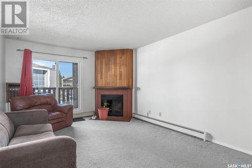 1420 425 115Th Street E, Saskatoon, SK - Indoor Photo Showing Living Room With Fireplace