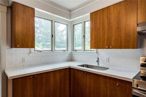 Two large windows giving the kitchen lots of natural light. - 76 Weir Street N, Hamilton, ON - Indoor Photo Showing Kitchen