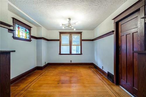 Traditional dining room featuring stained glass and a chair rail. - 76 Weir Street N, Hamilton, ON - Indoor Photo Showing Other Room