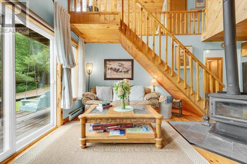 1018A Leisure Lane, North Frontenac, ON - Indoor Photo Showing Other Room With Fireplace