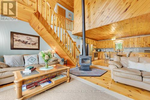 1018A Leisure Lane, North Frontenac, ON - Indoor Photo Showing Living Room With Fireplace